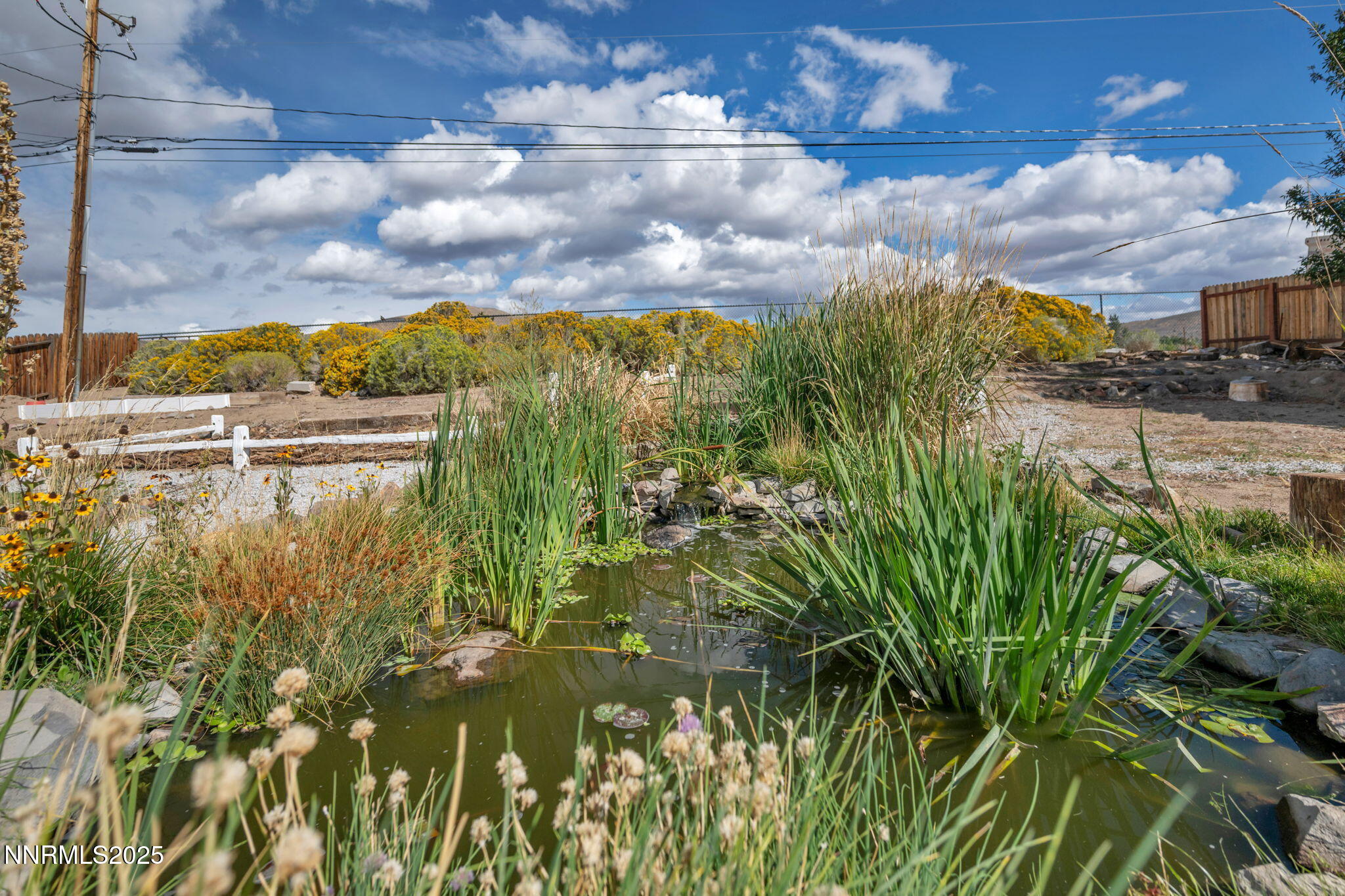 17475 Egret Lane Reno, NV 89508 - Photo 23 of 67 a view of a lake with a building in the background