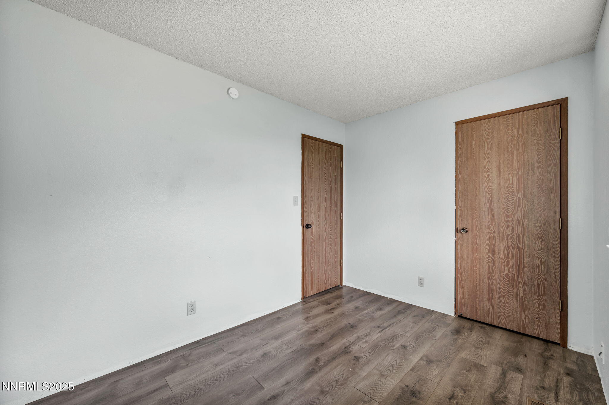 17475 Egret Lane Reno, NV 89508 - Photo 48 of 67 a view of an empty room with wooden floor and closet