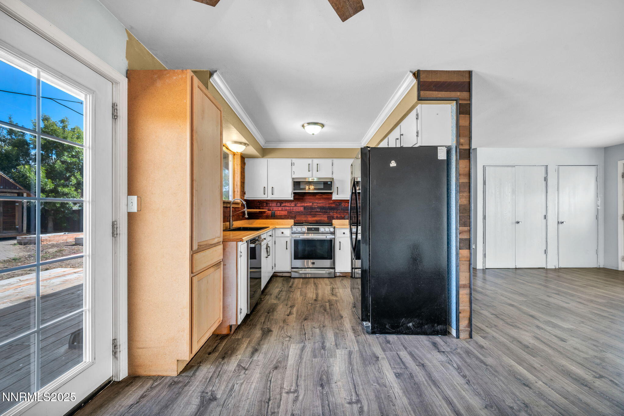 17475 Egret Lane Reno, NV 89508 - Photo 56 of 67 a kitchen with a refrigerator and wooden floor