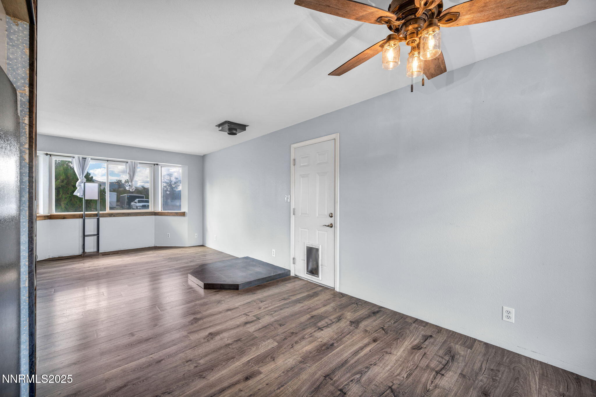 17475 Egret Lane Reno, NV 89508 - Photo 59 of 67 a view of an empty room with a window and wooden floor