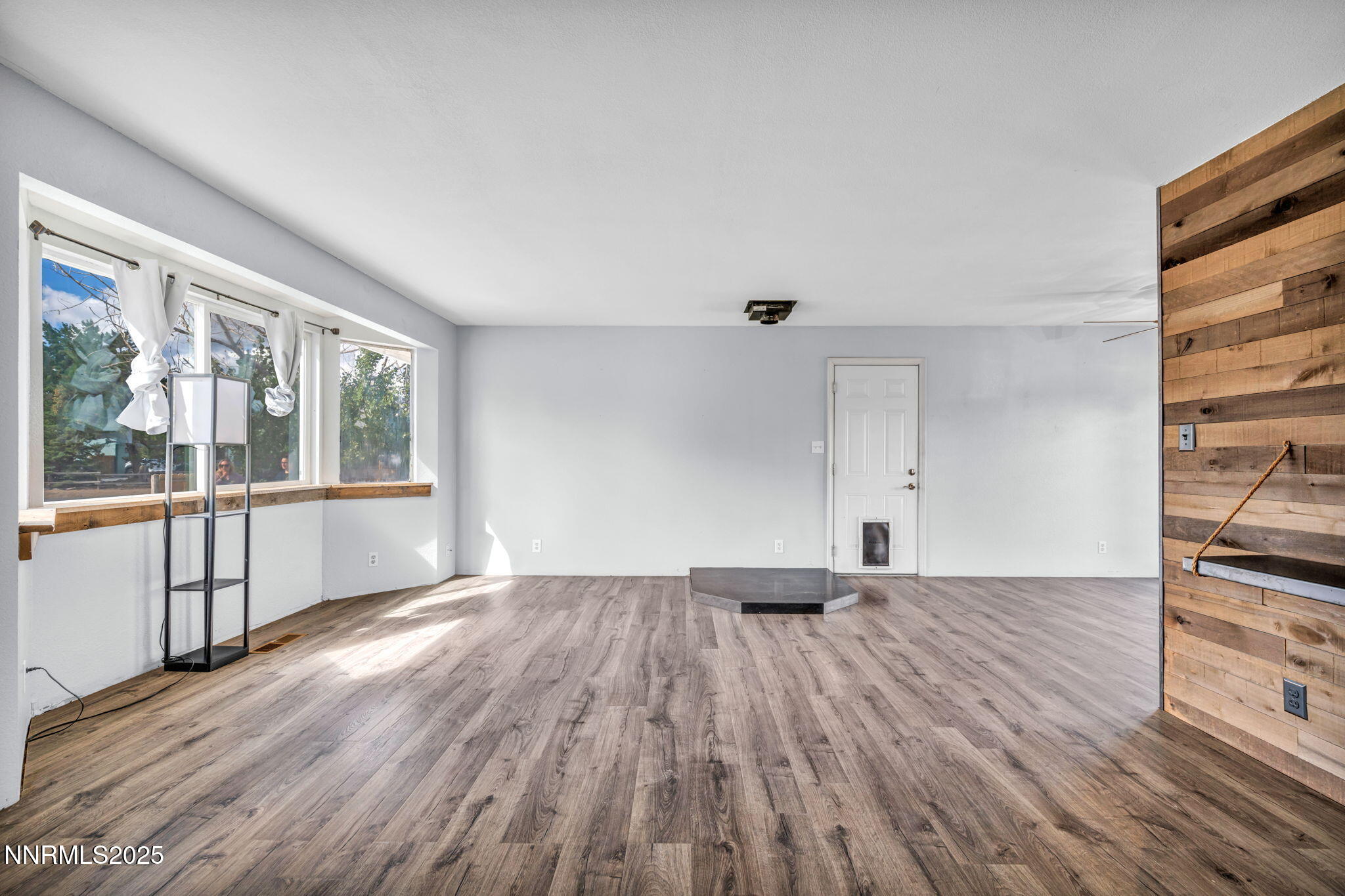 17475 Egret Lane Reno, NV 89508 - Photo 61 of 67 wooden floor in an empty room with a window