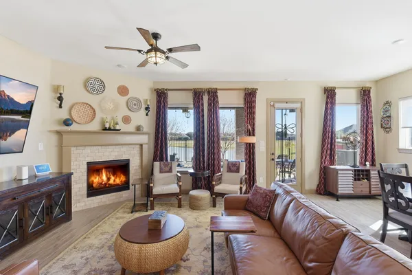 a living room with furniture and a fireplace