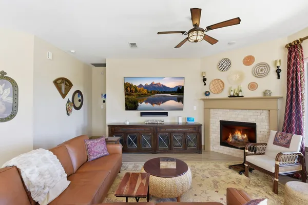 a living room with furniture and a fireplace
