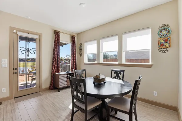 a view of a dining room with furniture and window
