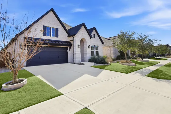 a front view of a house with yard