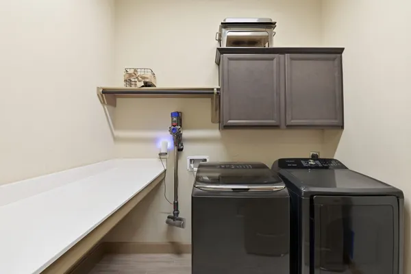 a utility room with dryer and washer