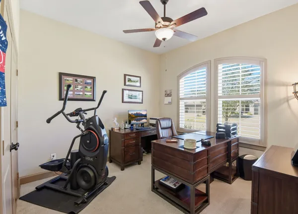 a room with gym equipment and a window