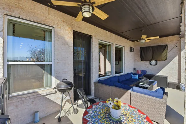 a living room with lots of furniture and a fireplace