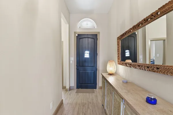 a bathroom with mirror and sink