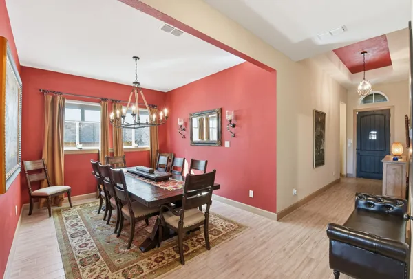 a dining room with furniture and window