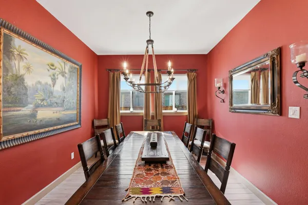 a very nice looking dining room with a table and chairs