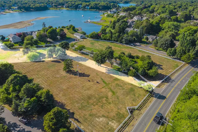 an aerial view of a house with a yard