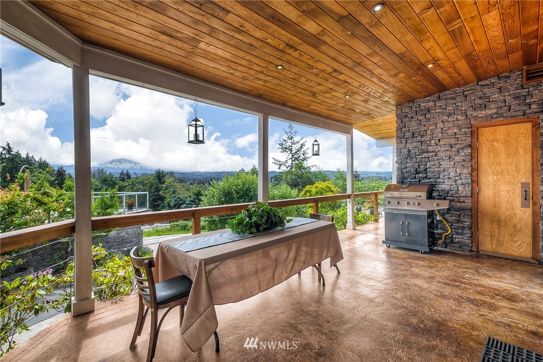 11112 Karshner Road East Edgewood, WA 98372 - Photo 15 of 40 a view of a chairs and table in the balcony