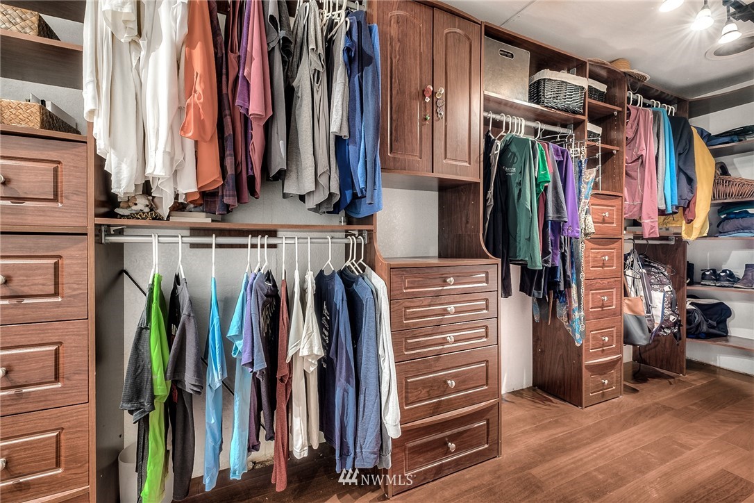 11112 Karshner Road East Edgewood, WA 98372 - Photo 16 of 40 a view of walk in closet with clothes