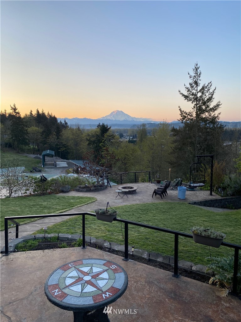 11112 Karshner Road East Edgewood, WA 98372 - Photo 3 of 40 a view of a park with large trees