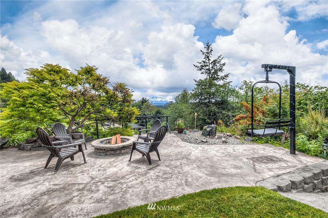 11112 Karshner Road East Edgewood, WA 98372 - Photo 28 of 40 a view of a backyard with sitting area