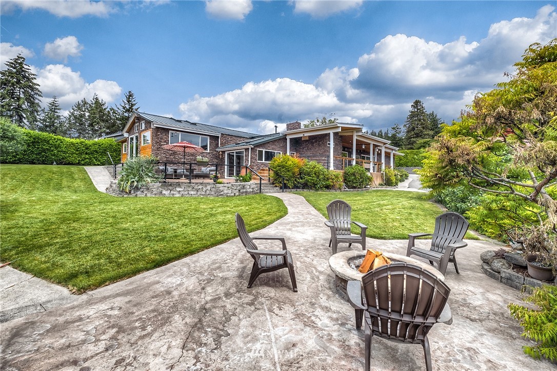 11112 Karshner Road East Edgewood, WA 98372 - Photo 29 of 40 a view of a house with backyard and sitting area