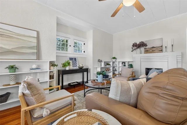 a living room with furniture fireplace and window