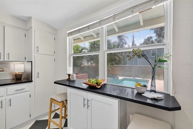 a kitchen with a sink and a window