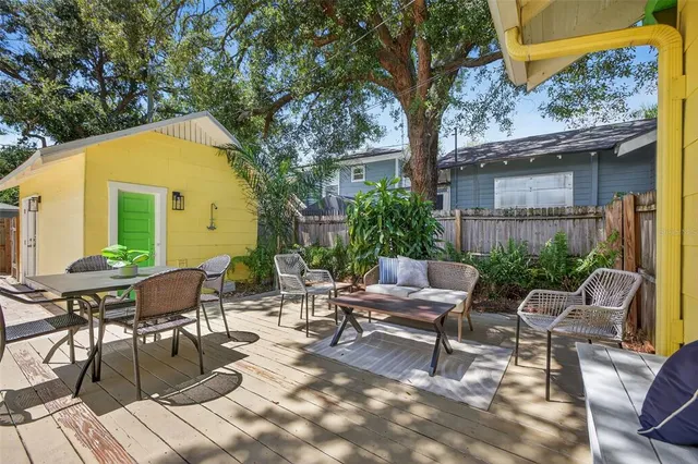 a view of a patio with a table and chairs in patio