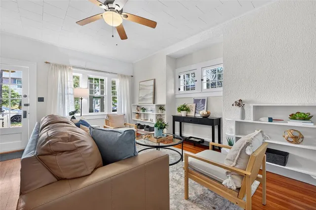 a living room with furniture and a window
