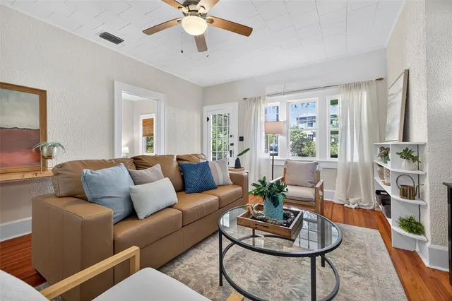 a living room with furniture and a large window