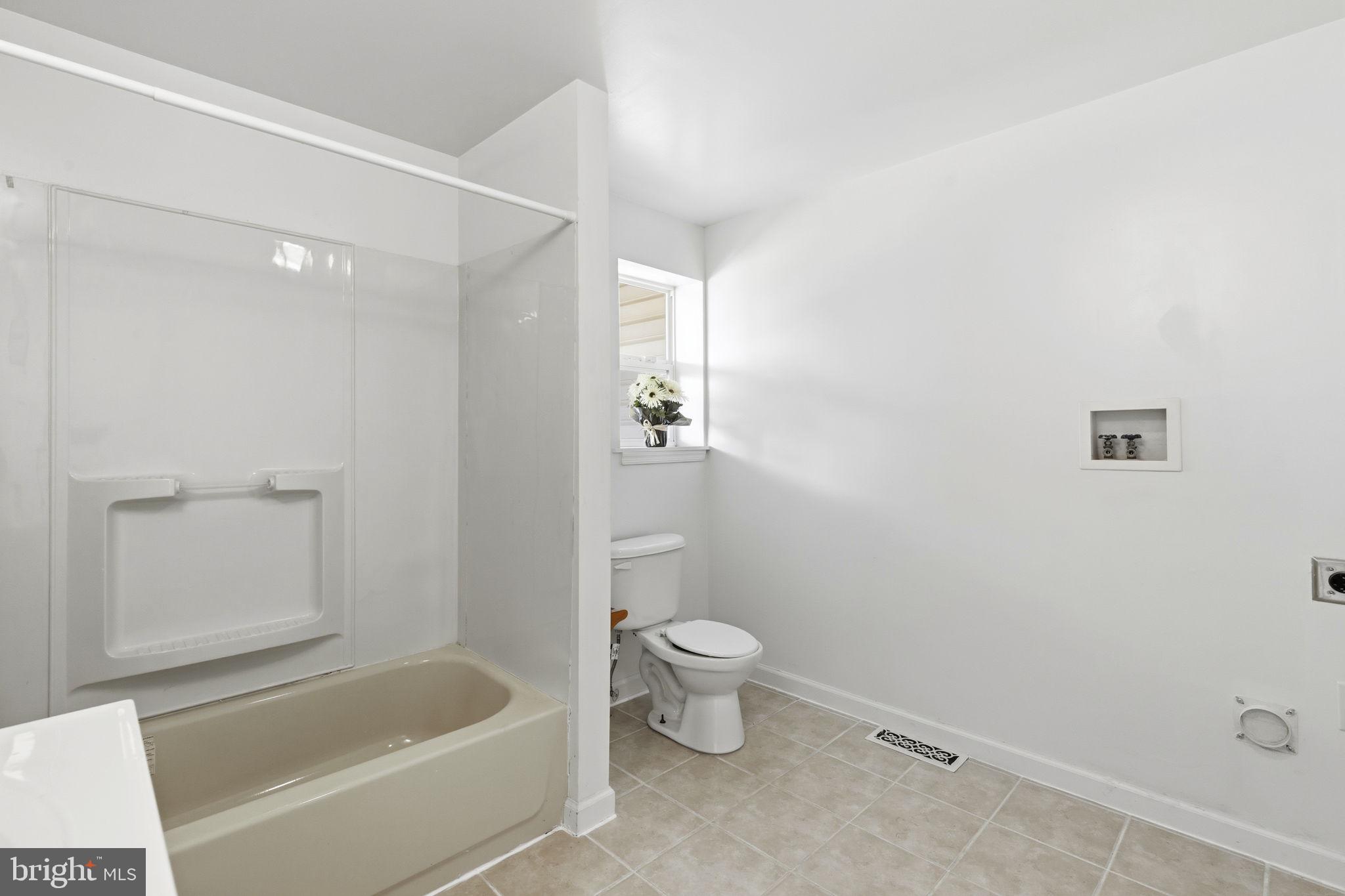 1311 North Broadway Baltimore, MD 21213 - Photo 14 of 24 Bright and airy bathroom retreat.