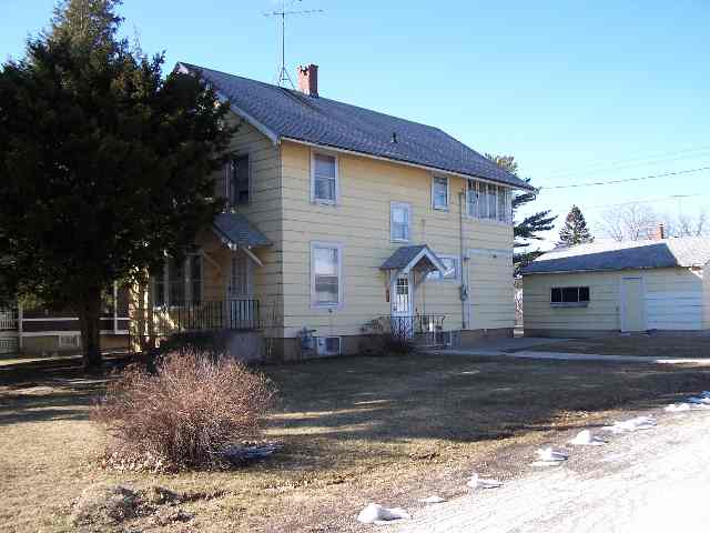 412 Ridge Street Mount Carroll, IL 61053 - Photo 1 of 9 a front view of a house with a yard