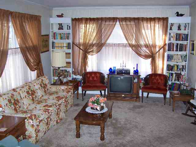 412 Ridge Street Mount Carroll, IL 61053 - Photo 5 of 9 a living room with furniture and a large window