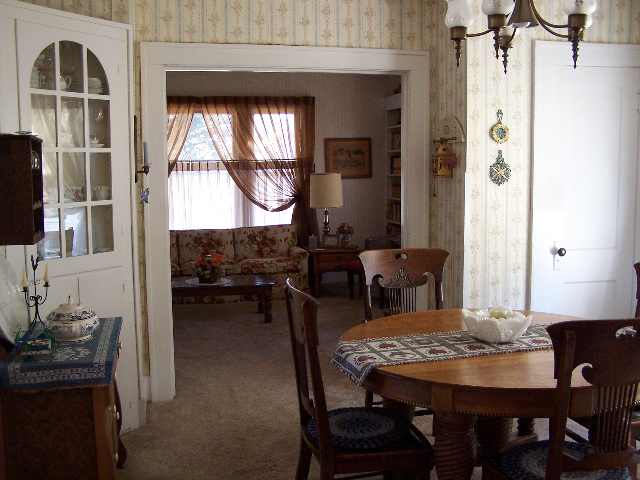 412 Ridge Street Mount Carroll, IL 61053 - Photo 8 of 9 a view of a dining room with furniture and window
