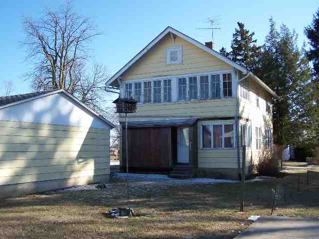 412 Ridge Street Mount Carroll, IL 61053 - Photo 9 of 9 a front view of a house with a yard