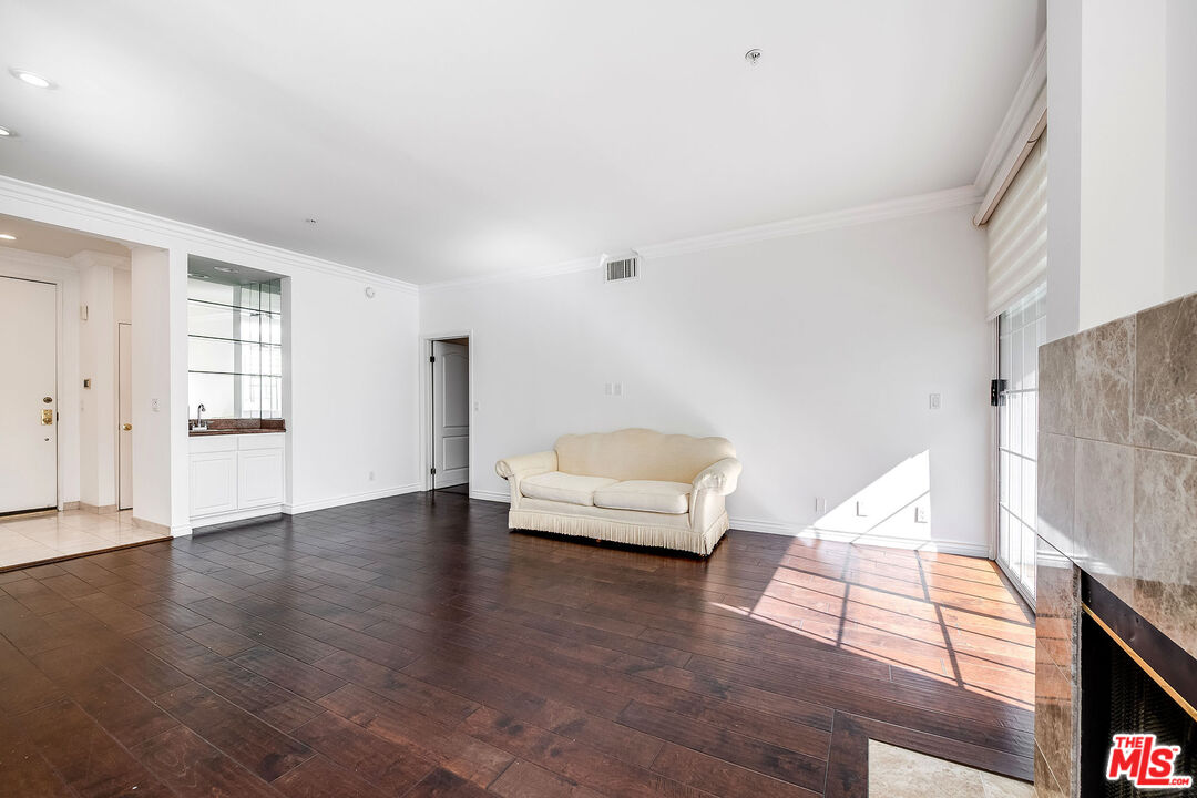 10630 Eastborne Avenue, Unit 203 Los Angeles, CA 90024 - Photo 13 of 26 a living room with furniture and wooden floor