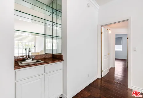 a kitchen with a sink and cabinets