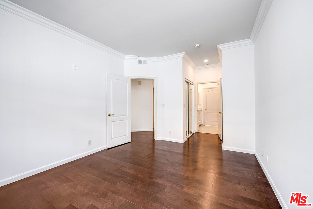 10630 Eastborne Avenue, Unit 203 Los Angeles, CA 90024 - Photo 17 of 26 a view of an empty room with wooden floor