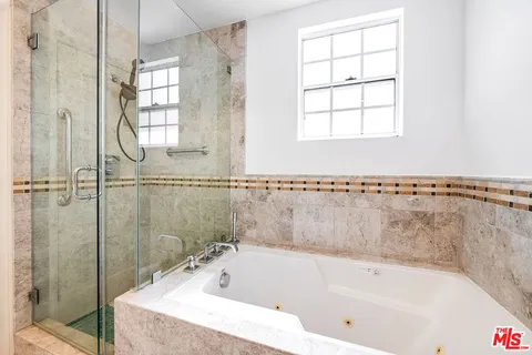 a bath tub sitting next to a window