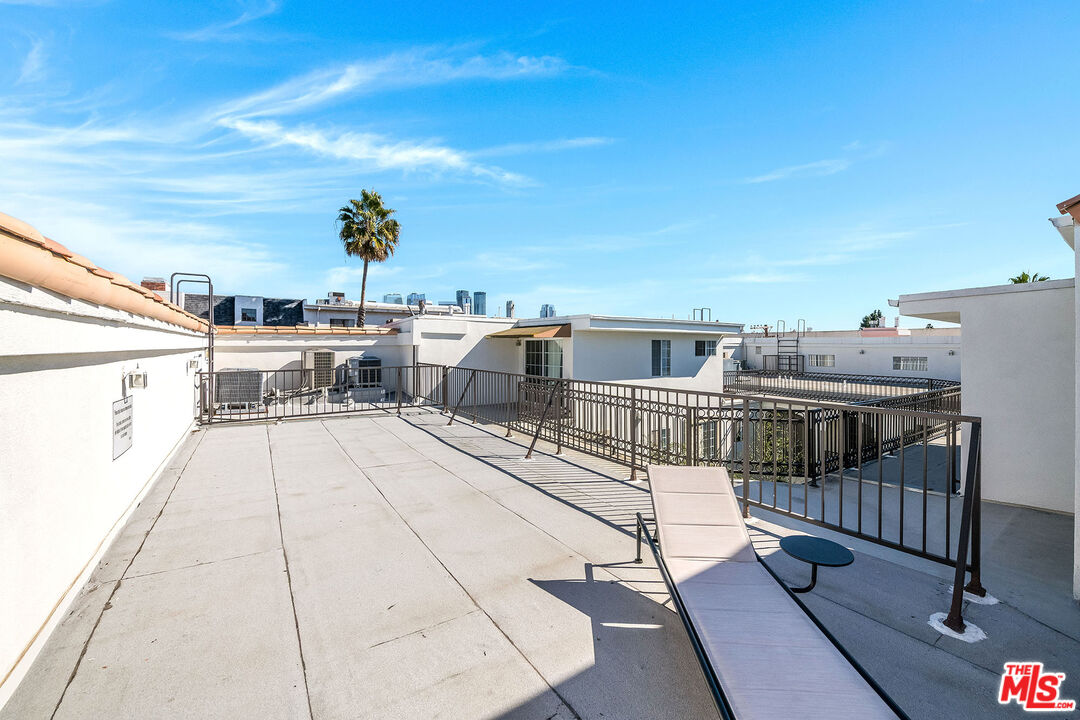 10630 Eastborne Avenue, Unit 203 Los Angeles, CA 90024 - Photo 25 of 26 a view of a balcony with chairs