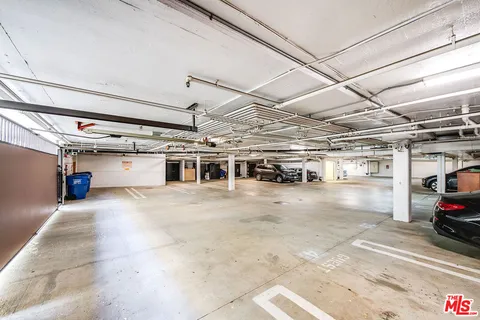 a view of parking garage with cars