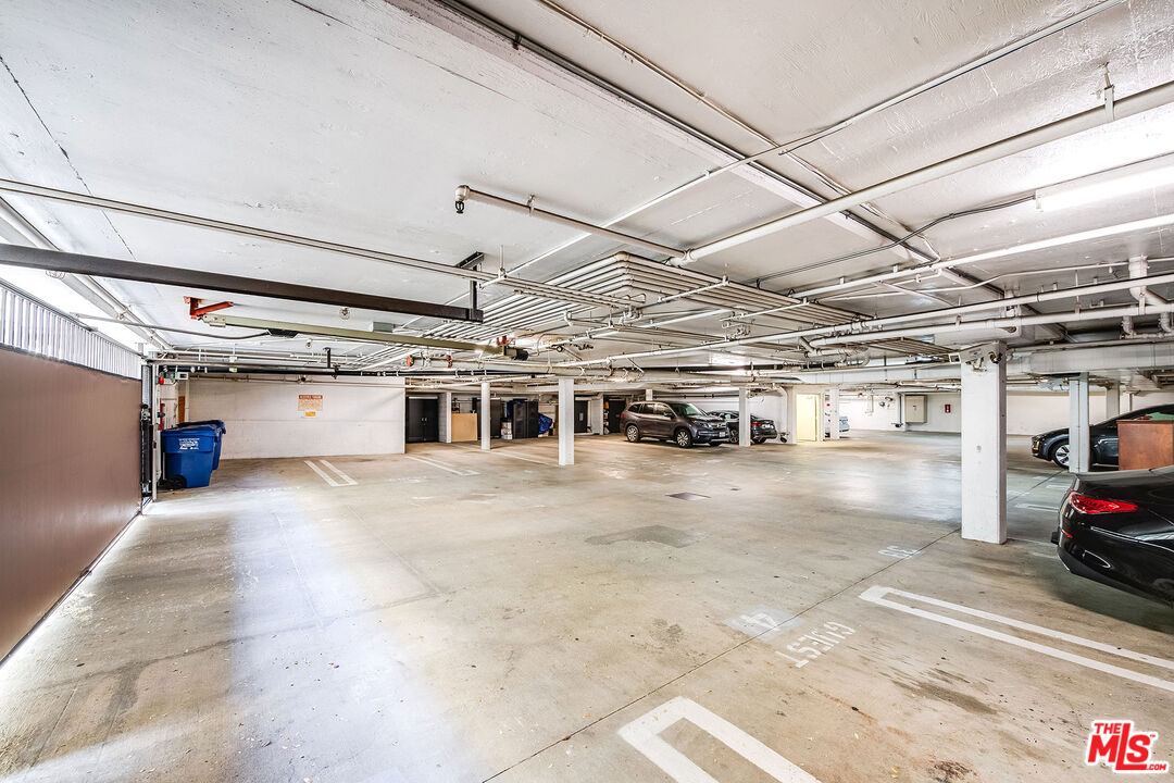 10630 Eastborne Avenue, Unit 203 Los Angeles, CA 90024 - Photo 26 of 26 a view of parking garage with cars