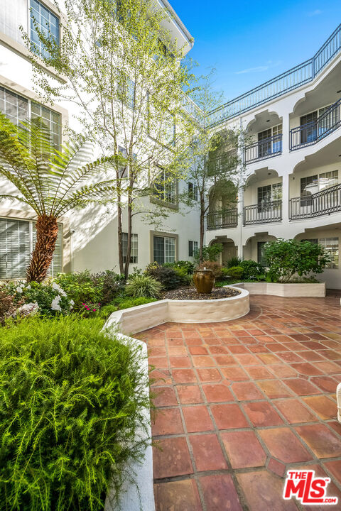 10630 Eastborne Avenue, Unit 203 Los Angeles, CA 90024 - Photo 3 of 26 a view of a building with garden