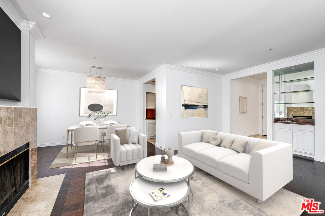 10630 Eastborne Avenue, Unit 203 Los Angeles, CA 90024 - Photo 8 of 26 a living room with furniture and a fireplace