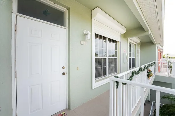 a view of balcony with wooden floor and fence