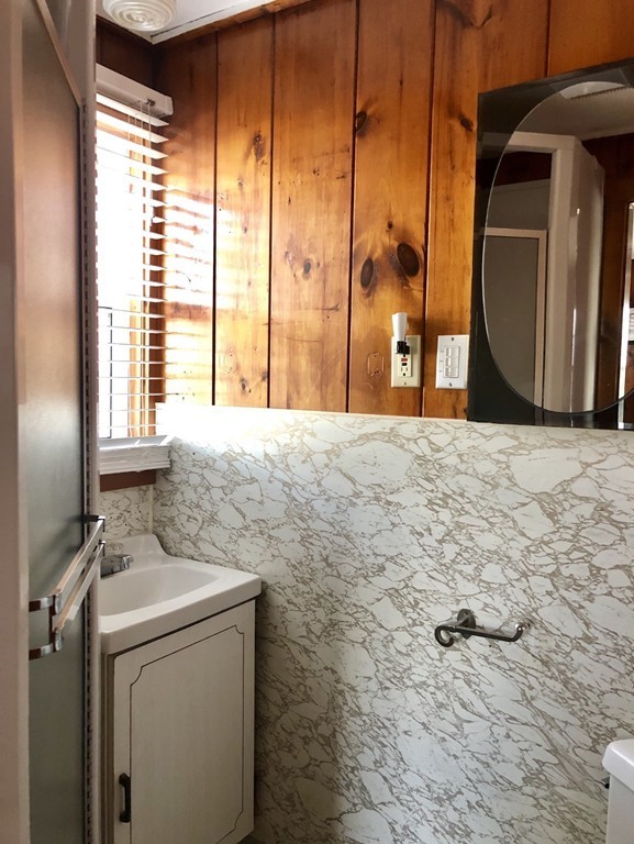 110 Glendon Road, Unit 9 Dennis, MA 02639 - Photo 13 of 22 a bathroom with a sink and a mirror
