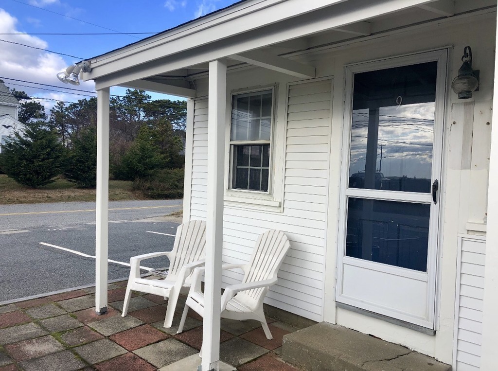 110 Glendon Road, Unit 9 Dennis, MA 02639 - Photo 3 of 22 a view of a chair and table in the balcony