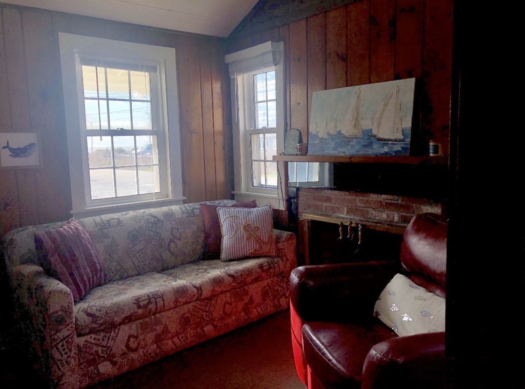 110 Glendon Road, Unit 9 Dennis, MA 02639 - Photo 7 of 22 a living room with furniture and a fireplace