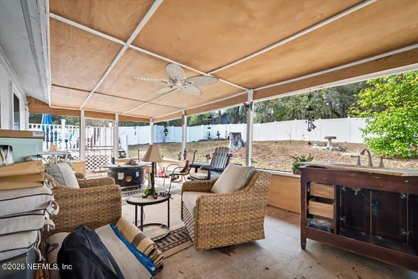 a patio with patio a couch and chairs