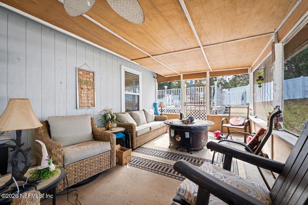 53 Lion Street Middleburg, FL 32068 - Photo 18 of 28 a living room with furniture and a large window