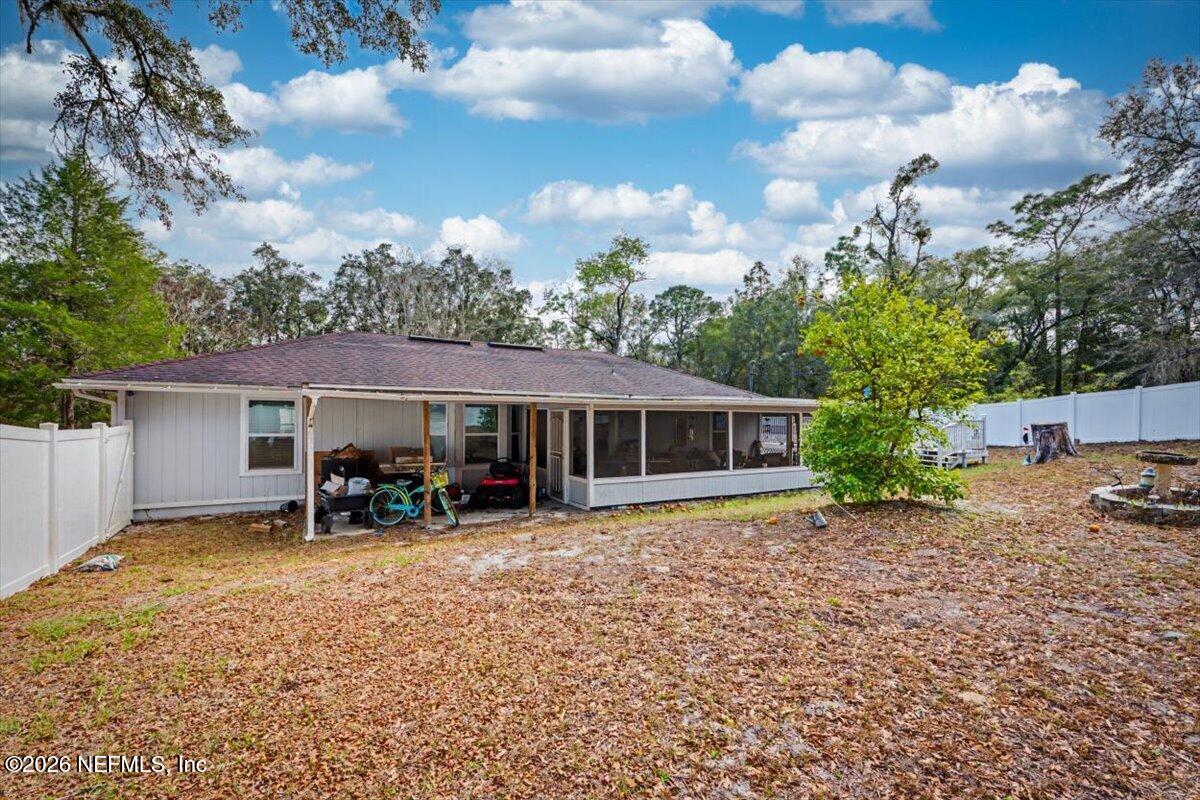 53 Lion Street Middleburg, FL 32068 - Photo 24 of 28 a view of a house with a yard and sitting area