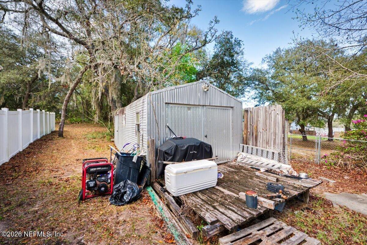 53 Lion Street Middleburg, FL 32068 - Photo 27 of 28 a view of a small house in the backyard