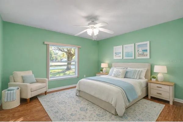 a bedroom with a bed and a couch