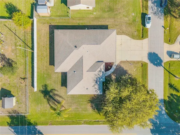 aerial view of a house with a yard